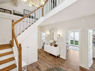 Step into luxury with this stunning property! Featuring a grand staircase, elegant hardwood floors, and a bright, airy design, this home offers both style and comfort.