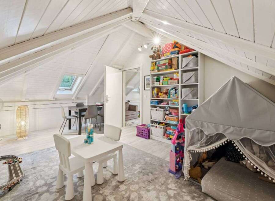Discover the charm of this unique property, featuring a bright and airy playroom perfect for children.