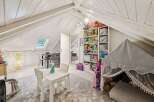 Discover the charm of this unique property, featuring a bright and airy playroom perfect for children.