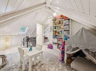 Discover the charm of this unique property, featuring a bright and airy playroom perfect for children.