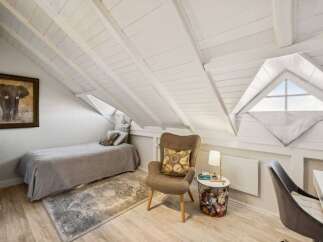 Discover the charm of this unique attic space, perfect for a cozy retreat.
