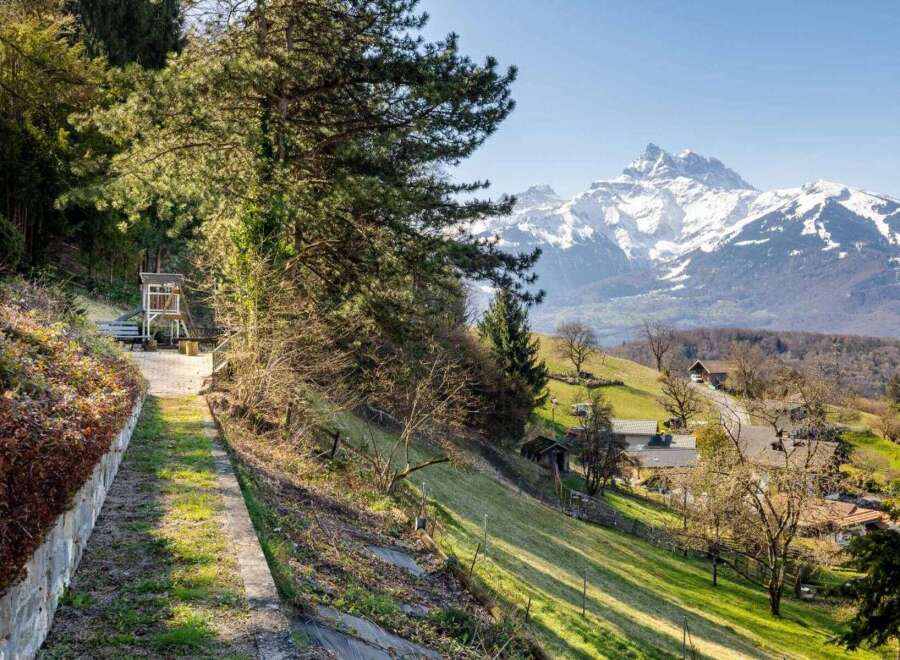 Discover your dream home nestled in the heart of nature, offering breathtaking mountain views.