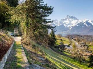 Discover your dream home nestled in the heart of nature, offering breathtaking mountain views.