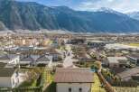 Discover this charming residential area nestled against a majestic mountain backdrop.