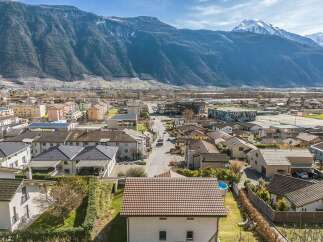 Discover this charming residential area nestled against a majestic mountain backdrop.