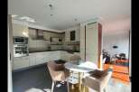 This stunning kitchen boasts modern design and functionality.