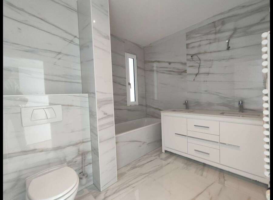 Step into luxury with this stunning modern bathroom.