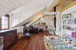 This stunning loft boasts a unique architectural design with exposed beams and a spacious layout.