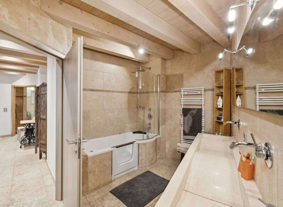 Step into luxury with this stunning bathroom featuring a walk-in shower and a modern design.