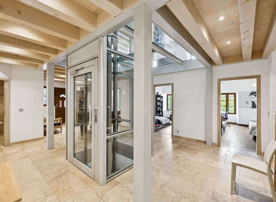 This stunning property boasts a modern elevator, seamlessly blending functionality with elegance.