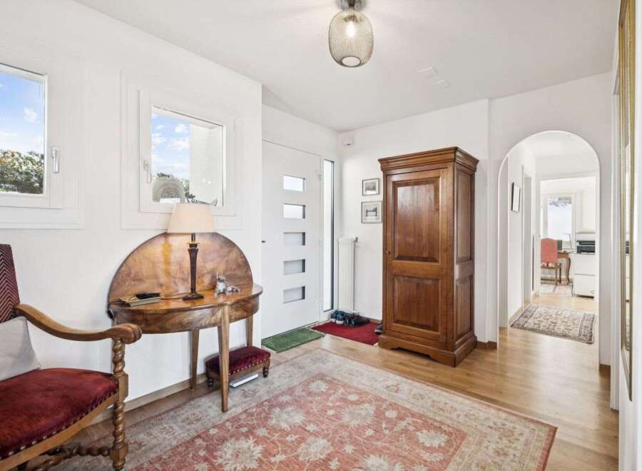 Step into this inviting entryway, showcasing a blend of classic charm and modern design.
