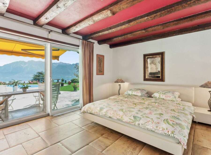 Experience luxury living in this stunning bedroom with breathtaking views.