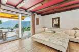 Experience luxury living in this stunning bedroom with breathtaking views.