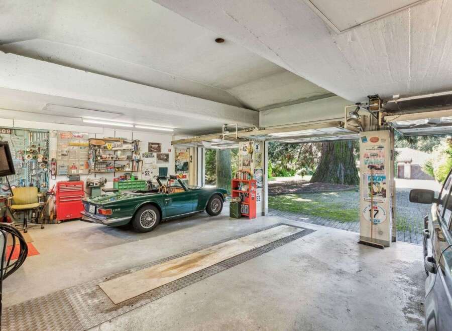 Step into this stunning garage, a haven for car enthusiasts and collectors alike.