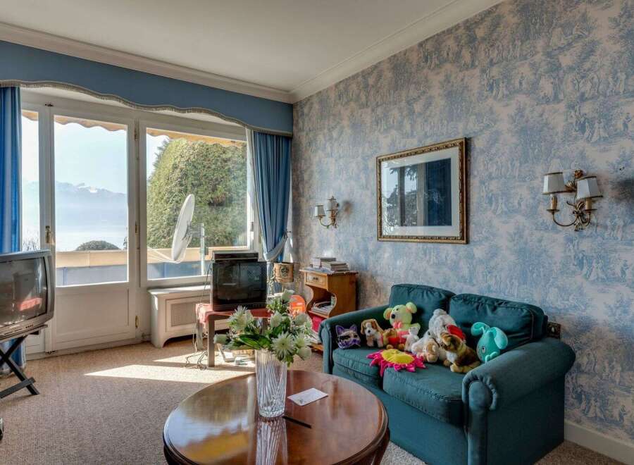 This charming living room offers stunning views and a cozy atmosphere.