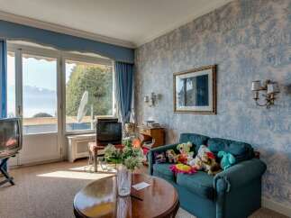 This charming living room offers stunning views and a cozy atmosphere.
