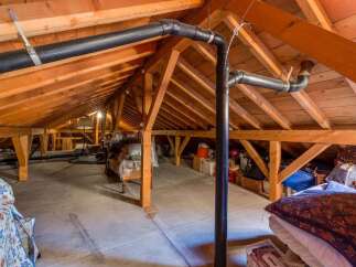 Discover the potential of this spacious attic, perfect for storage or conversion.