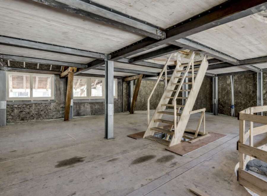 Explore this unique property featuring a raw, industrial aesthetic.