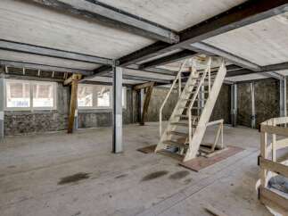 Explore this unique property featuring a raw, industrial aesthetic.