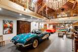 Step into luxury with this stunning property featuring a classic car collection and a sophisticated interior.
