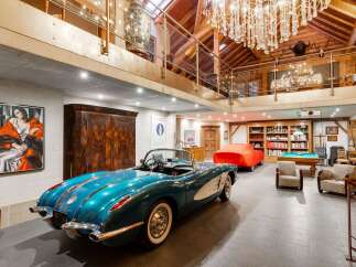 Step into luxury with this stunning property featuring a classic car collection and a sophisticated interior.