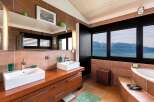 This luxurious bathroom boasts stunning views and modern design.