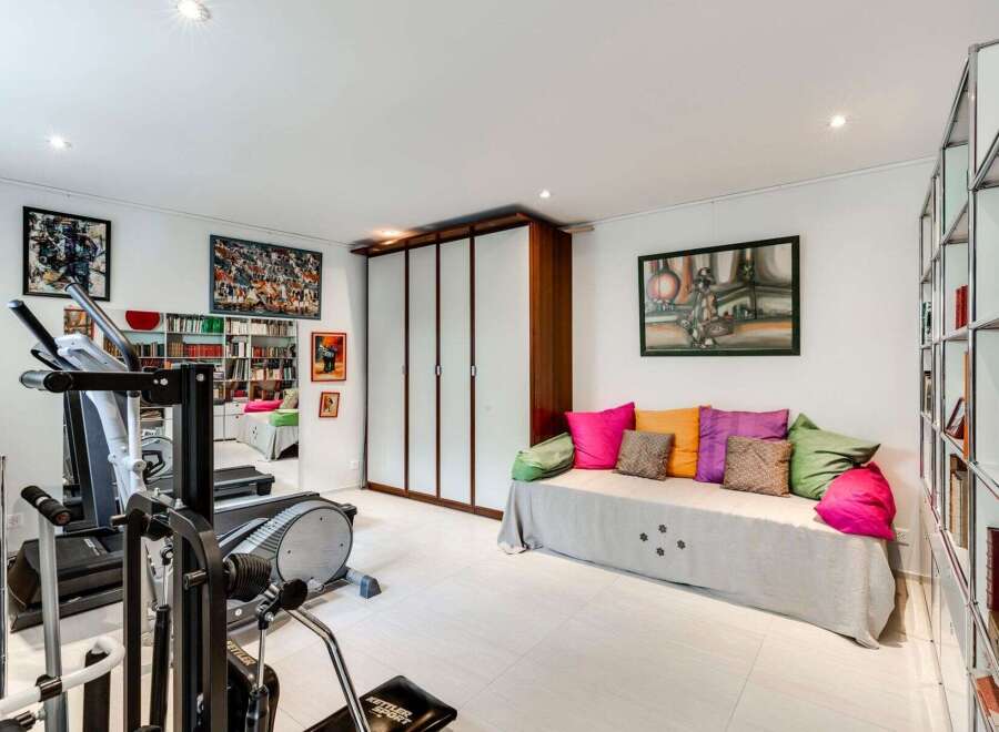 This bright and airy home gym offers a perfect blend of fitness and relaxation.