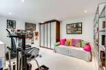 This bright and airy home gym offers a perfect blend of fitness and relaxation.