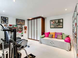 This bright and airy home gym offers a perfect blend of fitness and relaxation.