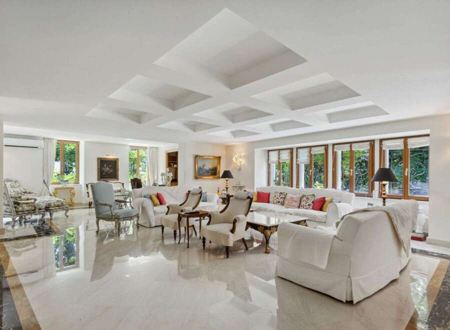 Step into luxury with this stunning living room, featuring a bright and airy design.