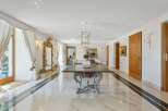 Step into luxury with this stunning property featuring a grand dining room.