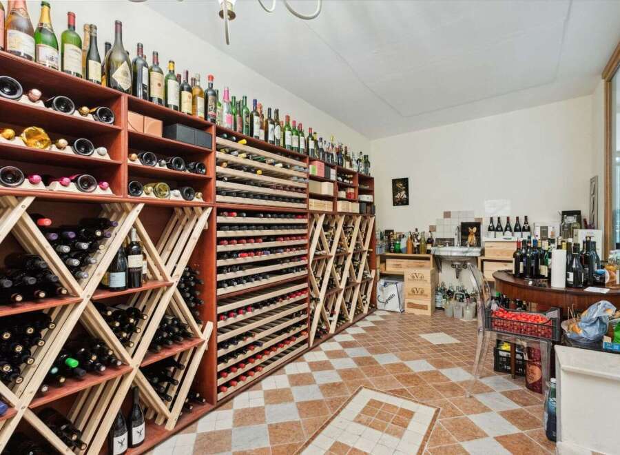 Discover the epitome of luxury living with this stunning property, featuring a dedicated wine cellar.