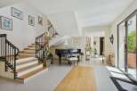 Step into luxury with this stunning property featuring a grand staircase and elegant design.