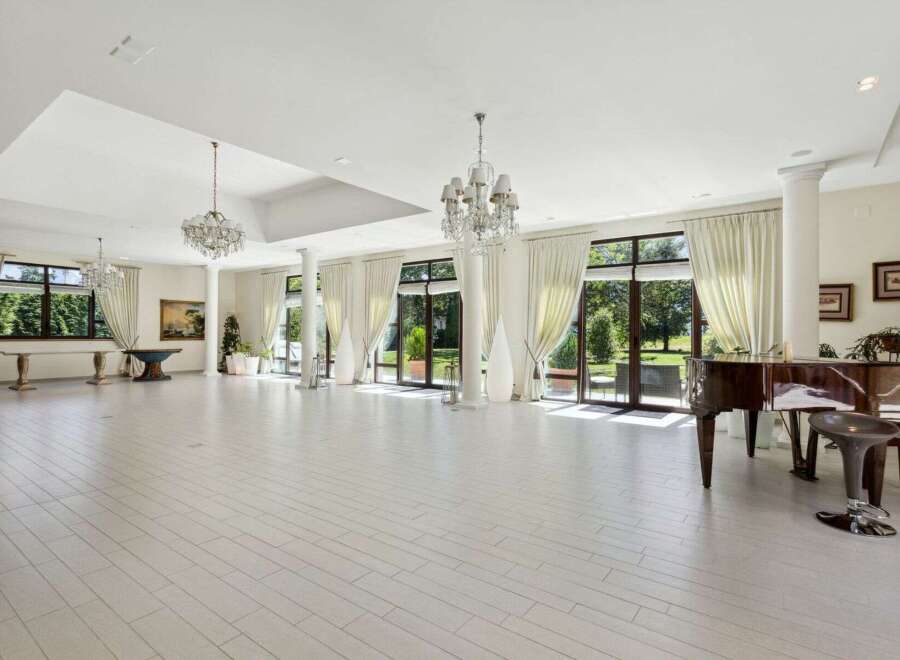 This stunning property boasts a grand ballroom with soaring ceilings and elegant chandeliers, perfect for hosting memorable events.