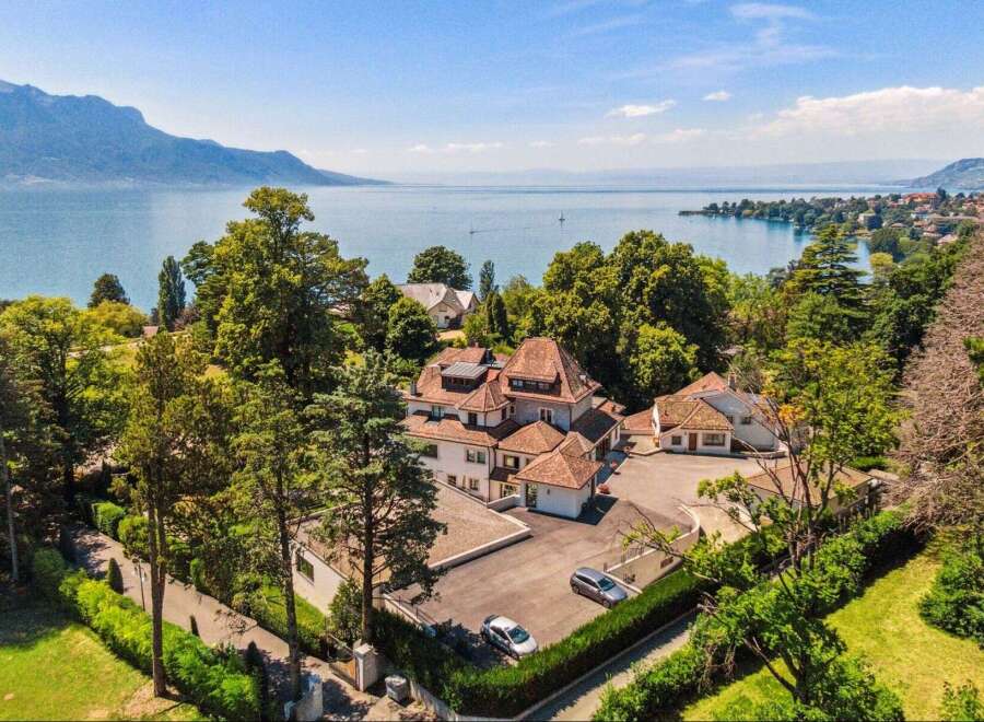 Discover the epitome of luxury living with this stunning property, boasting breathtaking views of the serene lake and surrounding mountains.
