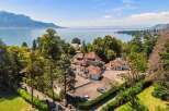 Discover the epitome of luxury living with this stunning property, boasting breathtaking views of the serene lake and surrounding mountains.