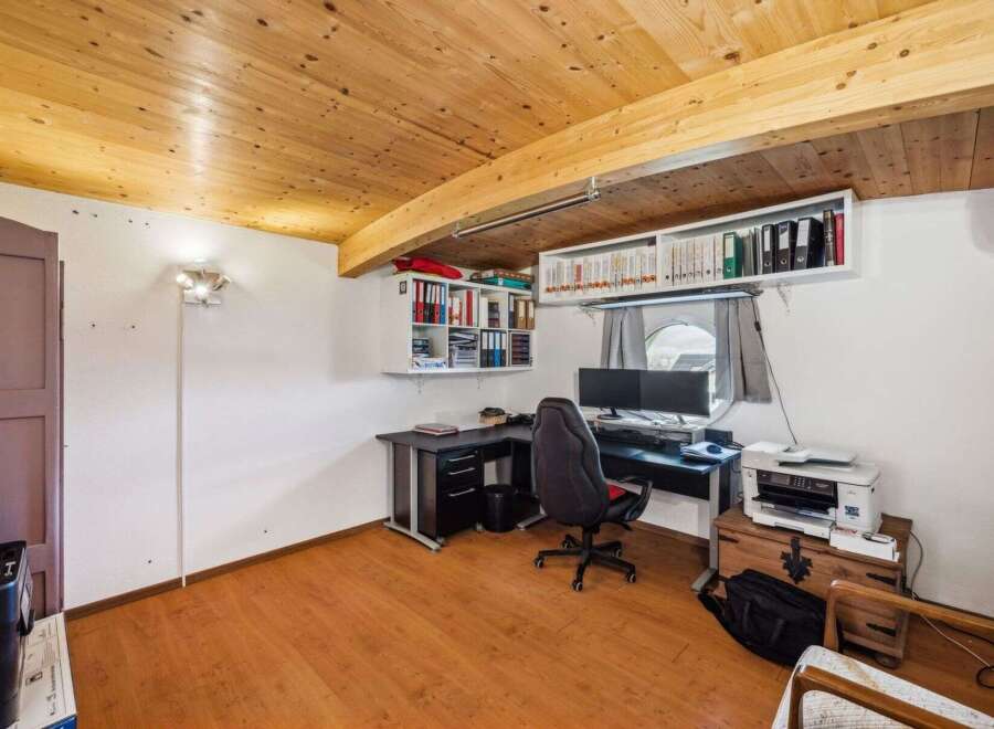 Discover the perfect home office setup in this inviting space! Featuring a stylish desk, comfortable chair, and ample storage, this room is designed for productivity and comfort.