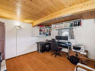 Discover the perfect home office setup in this inviting space! Featuring a stylish desk, comfortable chair, and ample storage, this room is designed for productivity and comfort.