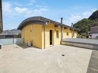 Discover this stunning property featuring a unique curved design and a spacious outdoor area.