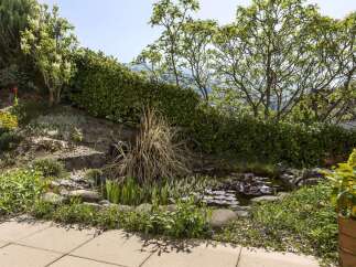 This stunning property boasts a serene outdoor oasis, perfect for relaxation and entertaining.