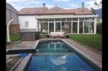 Discover luxury living with this stunning property featuring a private pool and a relaxing hot tub.