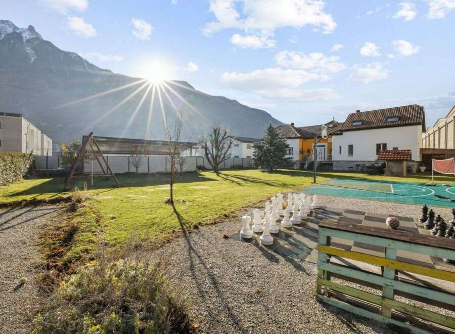 Discover a unique property featuring a giant chess set, perfect for outdoor entertainment.