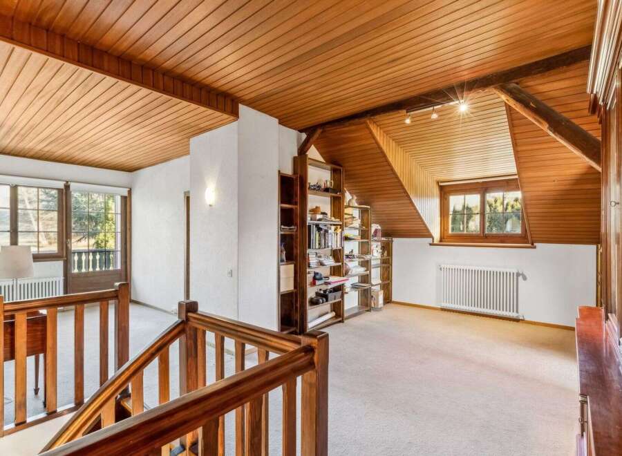 Discover the charm of this stunning property, featuring a beautifully designed interior with wooden accents throughout.