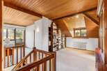 Discover the charm of this stunning property, featuring a beautifully designed interior with wooden accents throughout.