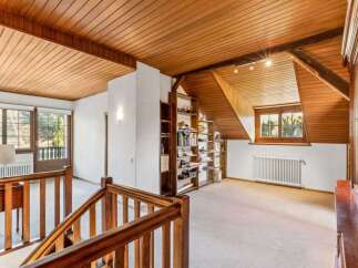 Discover the charm of this stunning property, featuring a beautifully designed interior with wooden accents throughout.