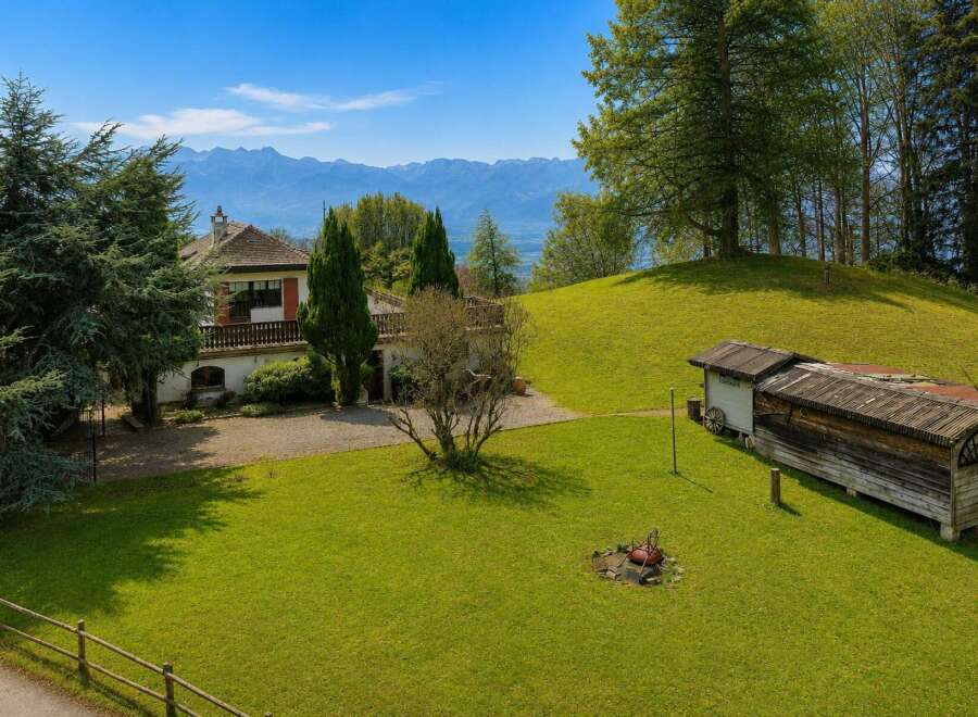 Nestled amidst rolling green hills, this property offers a serene retreat with breathtaking mountain views.