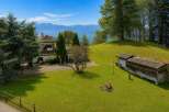 Nestled amidst rolling green hills, this property offers a serene retreat with breathtaking mountain views.