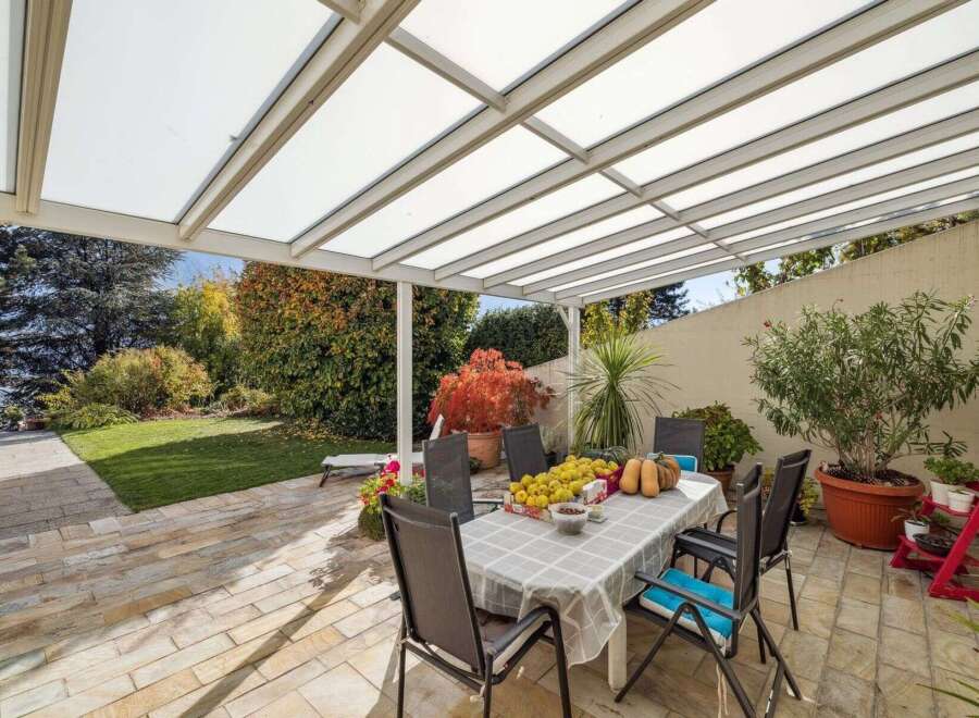 Enjoy outdoor living at its finest with this stunning property featuring a covered patio, perfect for entertaining or relaxing.