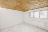 Discover this bright and airy room, featuring a unique textured ceiling that adds character.