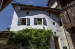Discover the charm of this historic property, featuring a unique architectural design with traditional shutters and windows.